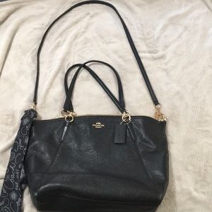Black pebble leather large Coach purse.